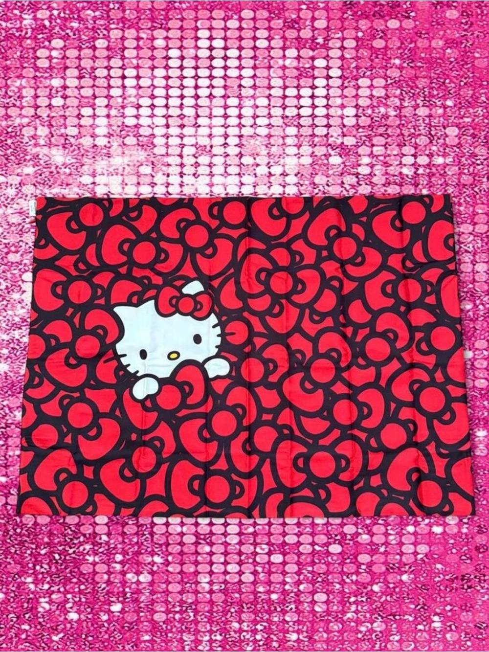 Kitsch × Hello Kitty Satin Pillowcase in Kitty Bathes in a Sea of Bows